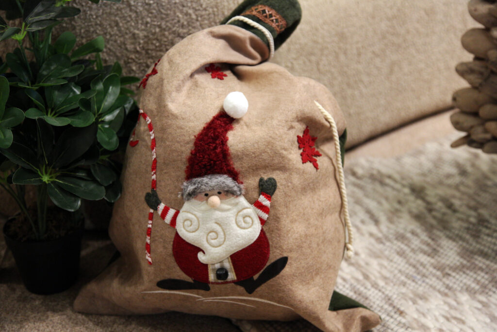 Joyous santa sack filled with presents ready for christmas