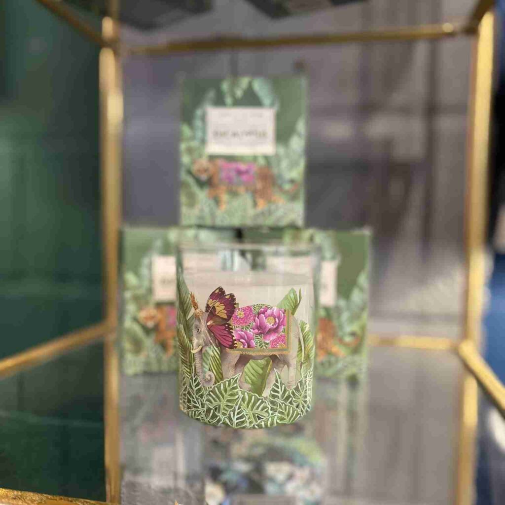 Eucalyptus scented candle sitting on a glass top creating an amazing scent for a home's interior