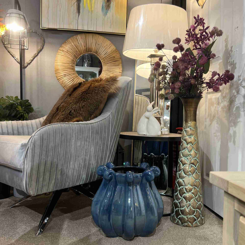 Patterned metal dry vase with some beautiful flowers in a modern styled living room